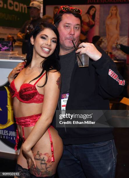 Adult film actress Gina Valentina and comedian/actor Doug Benson joke around at the Jules Jordan Video booth at the 2018 AVN Adult Entertainment Expo...