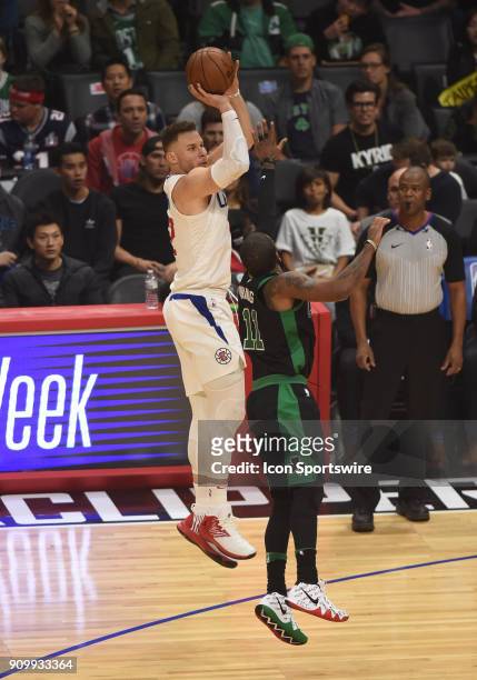 Los Angeles Clippers Forward Blake Griffin shoots over Boston Celtics Guard Kyrie Irving during an NBA game between the Boston Celtics and the Los...