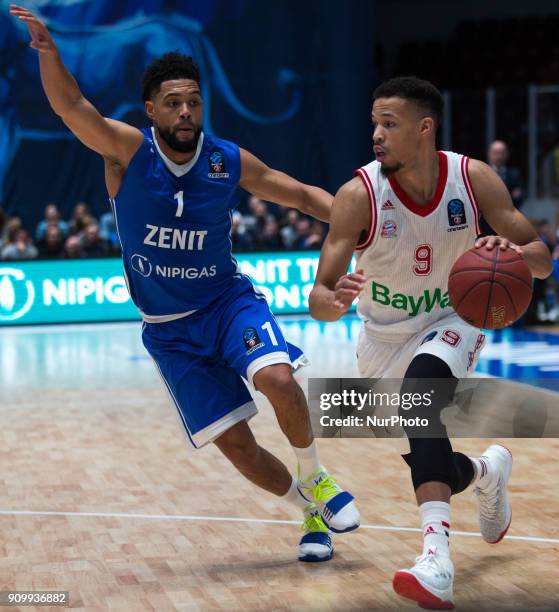 Munich's Jared Cunningham and Zenit's Scottie Reynolds vies for the ball during the EuroCup Round 4 Top 16 basketball match between Zenit and Bayern...