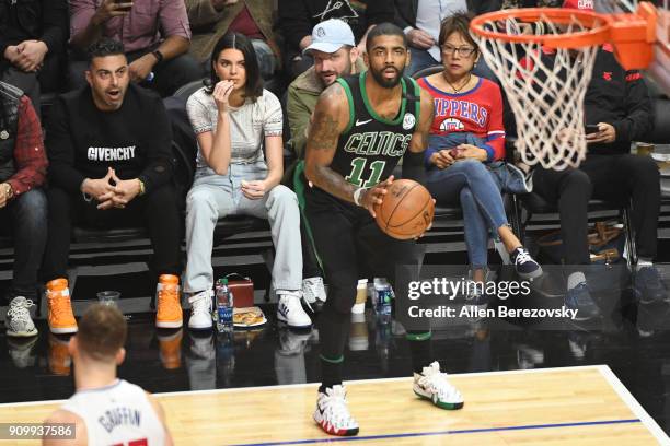 Model Kendall Jenner and producer Michael D. Ratner attend a basketball game between the Los Angeles Clippers and the Boston Celtics at Staples...