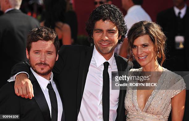 Cast members of the show "Entourage" Kevin Connolly, Adrian Grenier, and Perrey Reeves arrive for for the 2009 Emmy Awards at the Nokia Theater in...