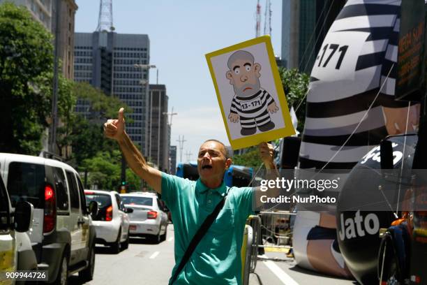 Protesters call for the conviction and arrest of former President Luiz Inacio Lula da Silva in a protest held in front of the São Paulo Museum of Art...