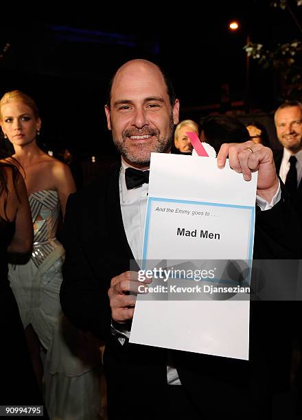 Creator Matthew Weiner holds up the paper for winning the Outstanding Drama Series award for 'Mad Men' backstage at the 61st Primetime Emmy Awards...