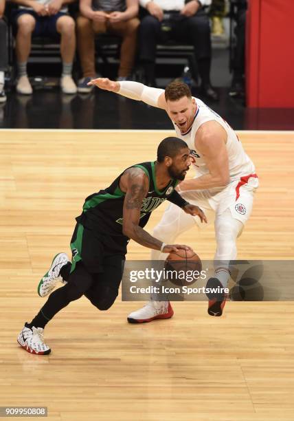 Boston Celtics Guard Kyrie Irving drives around Los Angeles Clippers Forward Blake Griffin during an NBA game between the Boston Celtics and the Los...