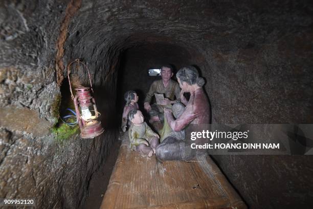 In this picture taken on January 18 concrete models illustrating daily life inside the tunnels during war time are pictured in the Vinh Moc tunnel...