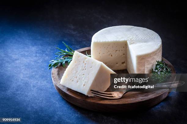 goat cheese - round wooden chopping board stock pictures, royalty-free photos & images