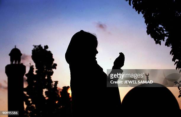 Muslim girl prays at the MCC mosque during the last Friday of the Muslim's holy fasting month of Ramadan in Silver Spring, Maryland on September 18,...
