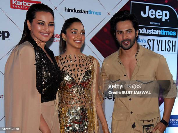 Indian Bollywood actors Sonakshi Sinha , Kiara Advani and Varun Dhawan pose for a picture as they attend the "HT India's Most Stylish Awards 2018" in...