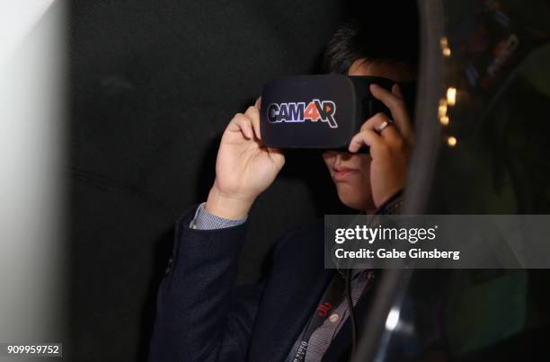 An attendee uses a virtual reality CAM4 program at the CAM4 booth during the 2018 AVN Adult Expo at the Hard Rock Hotel & Casino on January 24, 2018...