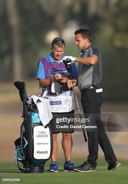 Chris Hanson of England plays his second shot on the par 5, third hole during the first round of the Omega Dubai Desert Classic on the Majlis Course...