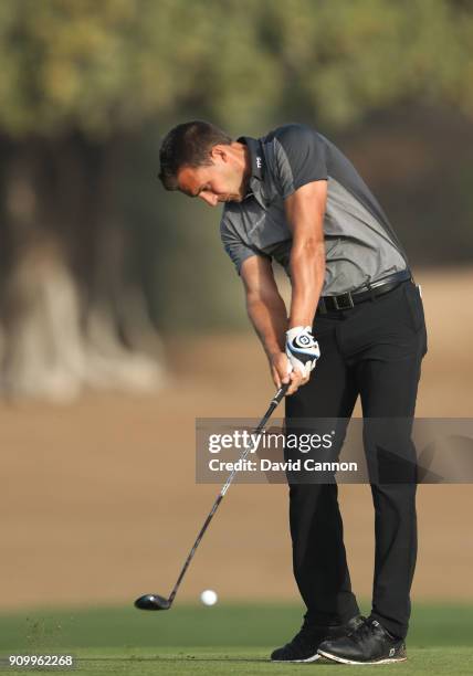 Chris Hanson of England plays his second shot on the par 5, third hole during the first round of the Omega Dubai Desert Classic on the Majlis Course...