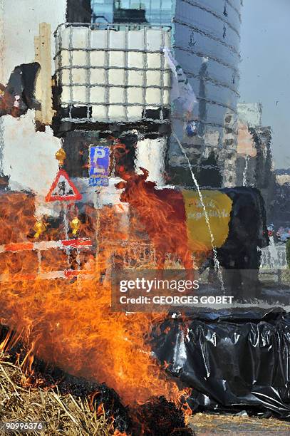 Belgian farmers dump milk in front of EU headquarters in Brussels on September 21, 2009 in Brussels to protest against plummeting milk prices....