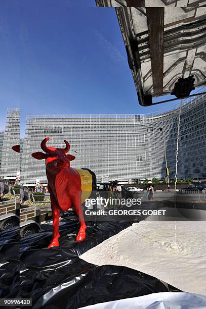 Belgian farmers dump milk in front of EU headquarters in Brussels on September 21, 2009 in Brussels to protest against plummeting milk prices....