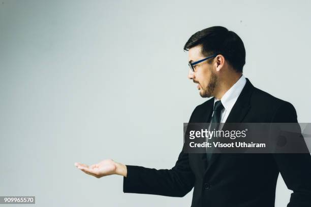 business man with empty hand - business man holding stock-fotos und bilder