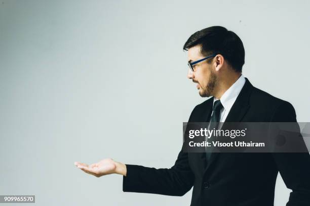 business man with empty hand - black suit close up stock pictures, royalty-free photos & images