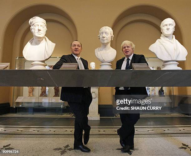 Mayor of London, Boris Johnson and Artistic Director of London's Old Vic theatre, Kevin Spacey pose for photographers in the Victoria and Albert...