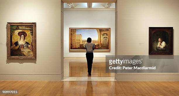 Turner's 'Rome from the Vatican' and 'Jessica' hang near Rembrandt's 'Girl at a Window' at the 'Turner and the Masters' exhibition at Tate Britain...
