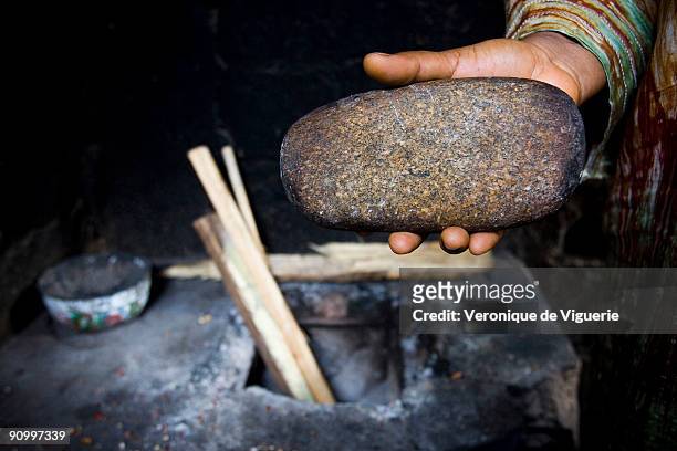 Philomene has used this stone to iron the breasts of her four daughters, heated in the oven. In Cameroon, there is a tradition of ironing girls'...