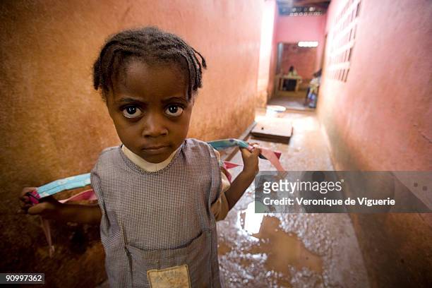 Young girl at school. Her older sister is currently enduring breast ironing, which she will also have to face in years to come. In Cameroon, there is...
