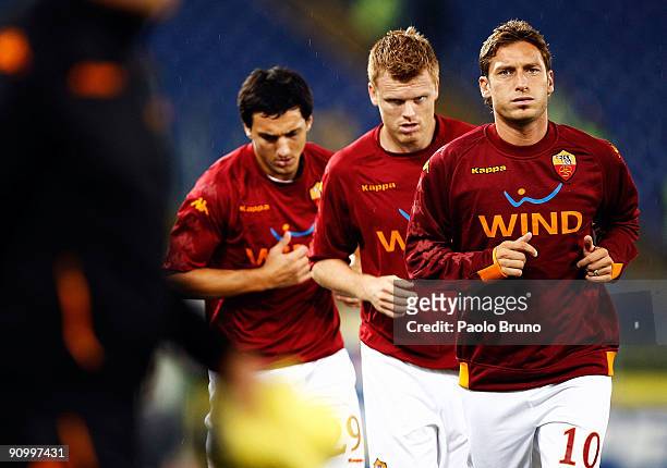 Francesco Totti, John Arne Riise and Nicolas Andres Burdisso of AS Roma in action during the training before the Serie A match between AS Roma and...