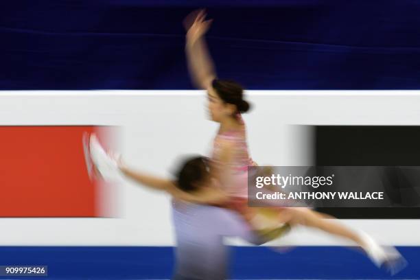 Kana Muramoto and Chris Reed perform during the ice dance - free dance program at the ISU Four Continents Figure Skating Championships in Taipei on...