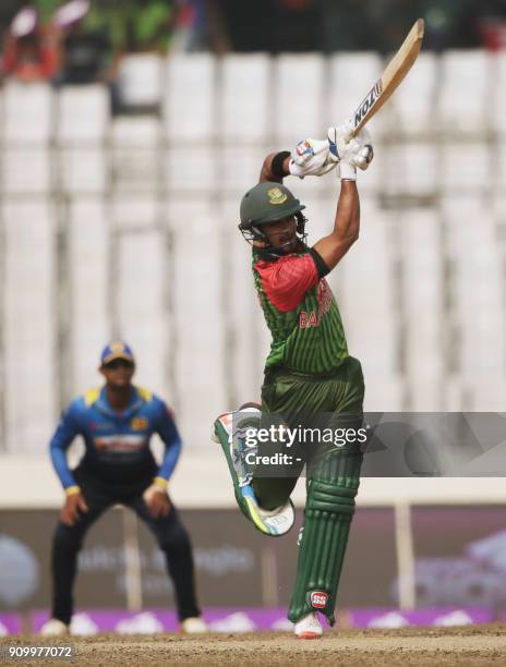 Bangladeshi cricketer Sabbir Rahman plays a shot flag during the sixth One Day International match in the Tri-Nations Series between Bangladesh and...