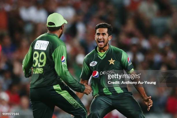 Haris Sohail of Pakistan celebrates with teammate Hasan Ali for the wicket of Tom Bruce of New Zealand during the International Twenty20 match...