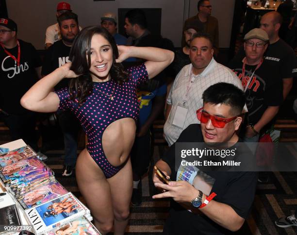 Adult film actress Abella Danger poses for fan photos at the Jules Jordan Video booth at the 2018 AVN Adult Entertainment Expo at the Hard Rock Hotel...