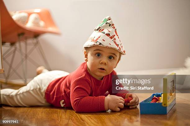 young boy dressed as elf playing with toolbox - siri stafford fotografías e imágenes de stock