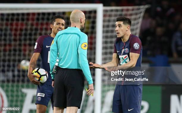 Referee Antony Gautier between Marquinhos and Yuri Berchiche of PSG during the French National Cup match between Paris Saint Germain and En Avant...