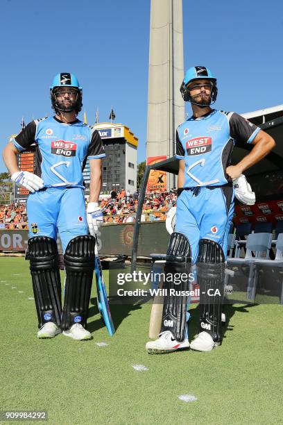Jono Dean and Jake Weatherald of the Strikers walk out to bat during the Big Bash League match between the Perth Scorchers and the Adelaide Strikers...