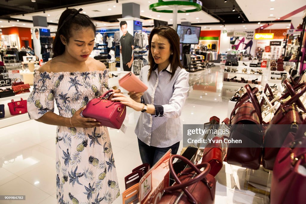 Thai transgender boxer Nong Rose browses handbags with her...