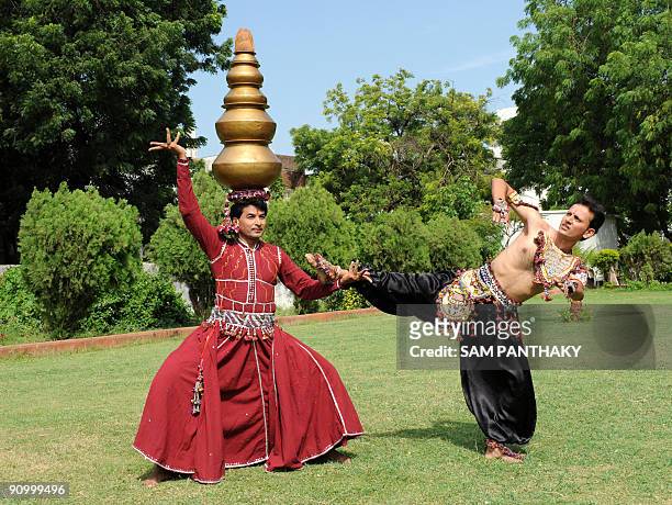 Indian dancer Bharat Bariya and his student Akshay Patel rehearse the 'Beda Nritya' at the Tagor Hall in Ahmedabad on September 21, 2009. Bariya has...