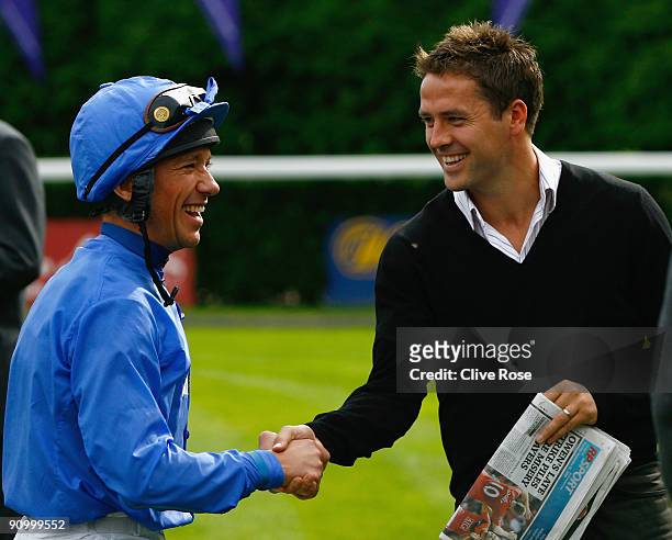 Michael Owen of Manchester United greets Frankie Dettori in the parade ring prior to the The George's Appeal - To Save Tiny Lives E.B.F maiden stakes...