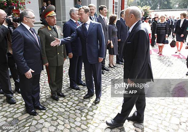 Russian President Dmitry Medvedev presents his delegation to Swiss counterpart Hans-Rudolf Merz upon his arrival at the Lohn residency in Kehrsatz,...