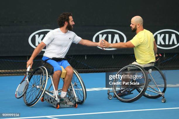 Adam Kellerman of Australia and Stefan Olsson of Sweden compete in the Men's Wheelchair Doubles semi-final against Stephane Houdet of France and...