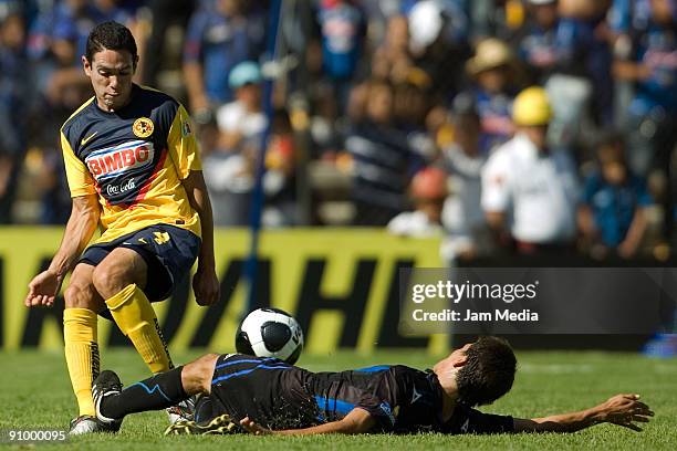 Oscar Rojas of Aguilas del America vies for the ball with Omar Maldonado of Queretaro during their match for the Mexican League Apertura 2009 at the...