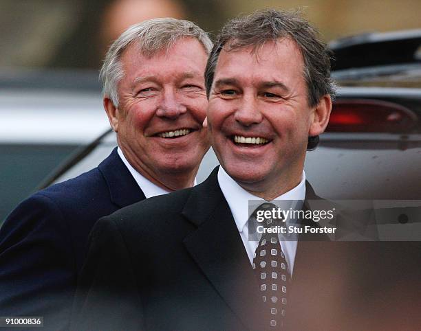 Former England footballer Bryan Robson and Manchester United manager Sir Alex Ferguson share a joke after the Sir Bobby Robson Memorial Service at...