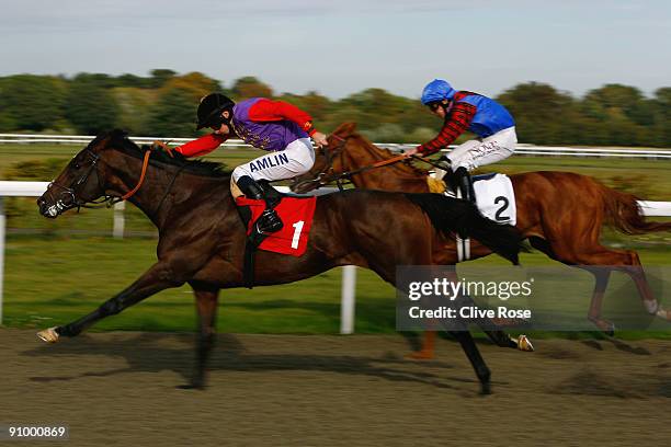 Highland Glen ridden by jockey Ryan Moore leads to win the Rooks Rider Handicap stakes at Kempton Park on September 21, 2009 in Sunbury, England.