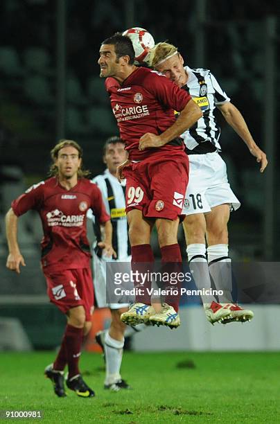 Christian Poulsen of Juventus FC clashes with Cristiano Lucarelli of AS Livorno during the Serie A match between Juventus FC and AS Livorno at...
