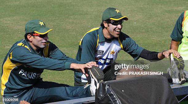 Pakistan cricketers Misbah-ul-Haq and Umar Gul warm up prior to training session at Wanderers in Johannesburg on September 21, 2009. The first match...