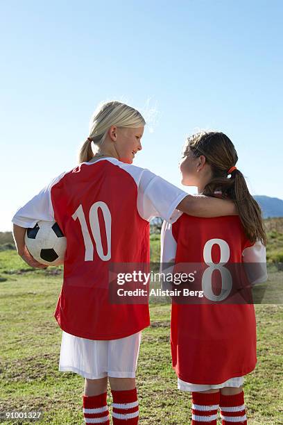 two girls in football kit - 10 11 years stock pictures, royalty-free photos & images