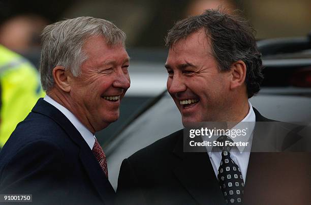 Former England footballer Bryan Robson and Manchester United manager Sir Alex Ferguson share a joke after the Sir Bobby Robson Memorial Service at...