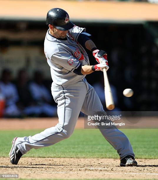 Jamey Carroll of the Cleveland Indians bats against the Oakland Athletics during the game at the Oakland-Alameda County Coliseum on September 19,...