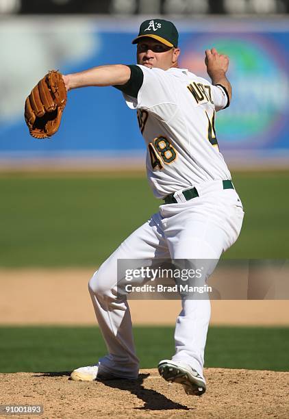 Michael Wuertz of the Oakland Athletics pitches against the Cleveland Indians during the game at the Oakland-Alameda County Coliseum on September 19,...