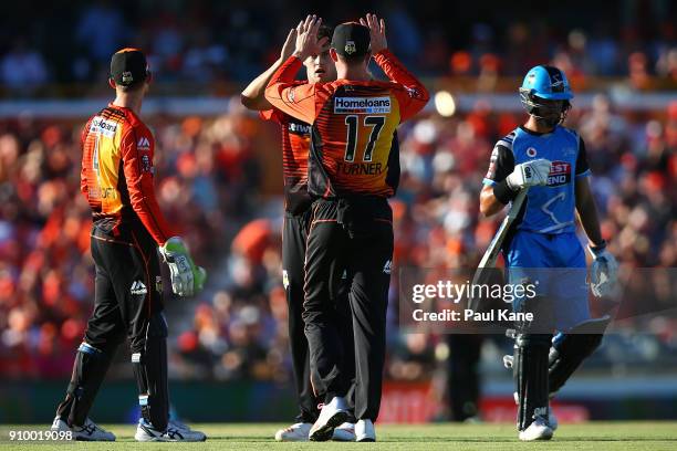 Matthew Kelly and Ashton Turner of the Scorchers celebrate the wicket of Jake Weatherald of the Strikers during the Big Bash League match between the...