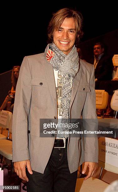 Singer Carlos Baute attends the Alma Aguilar fashion show during Cibeles Madrid Fashion Week S/S 2010 at Pasarela Cibeles on September 21, 2009 in...