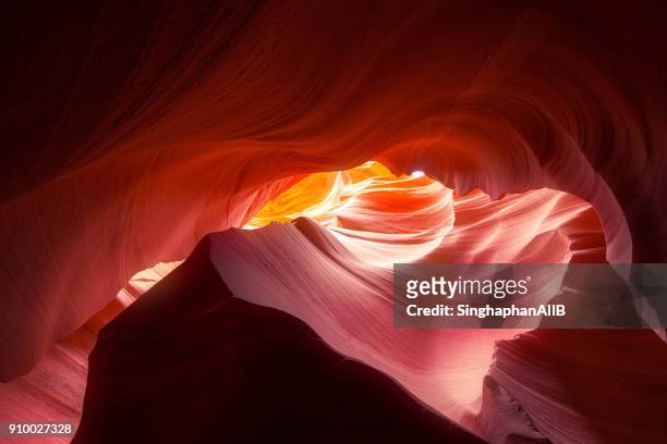 antelope canyon, wave shaped colorful sandstone and light in a slot canyon, page, arizona, usa - rock formation light stock pictures, royalty-free photos & images
