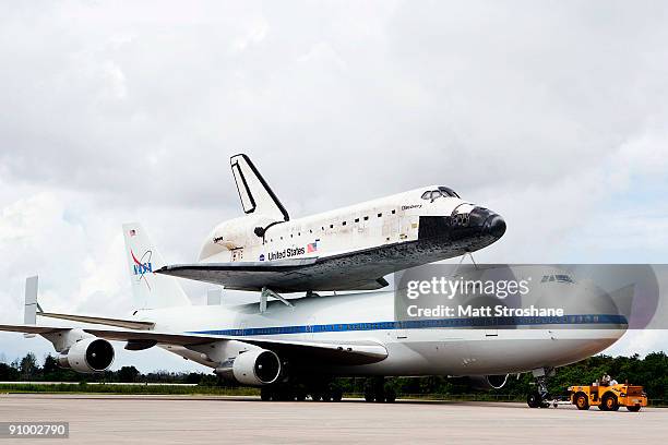 Space Shuttle Discovery, mounted atop a modified Boeing 747 shuttle carrier, taxis back to the mate-demate area after landing at the shuttle landing...