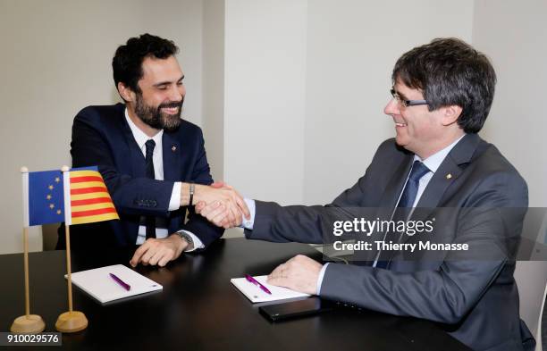 Parliament of Catalonia Roger Torrent and the ousted Catalan leader Carles Puigdemont pose as they meet on January 24, 2018 in Brussels, Belgium.